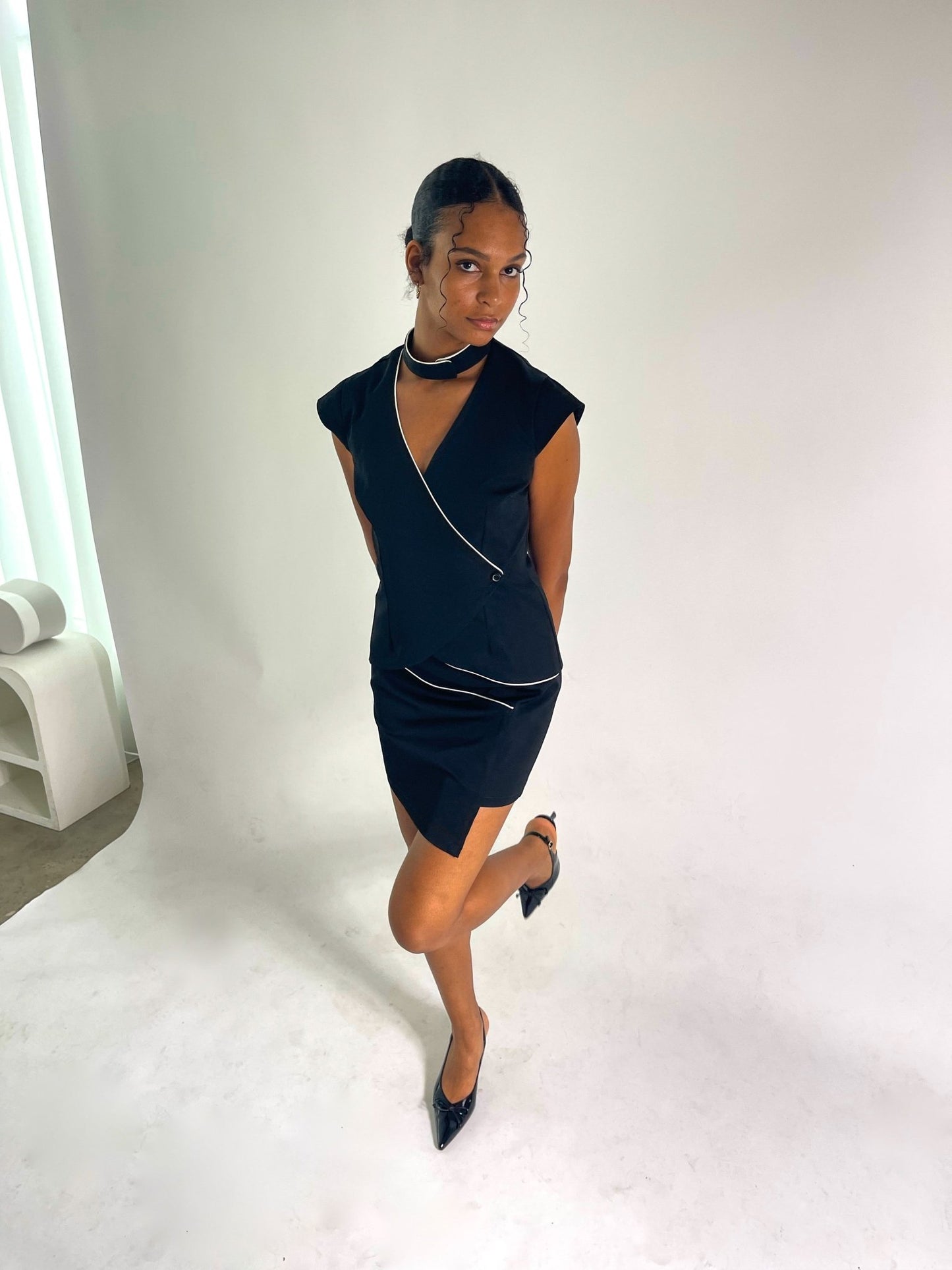 tailored black vest and skirt set with ivory piping