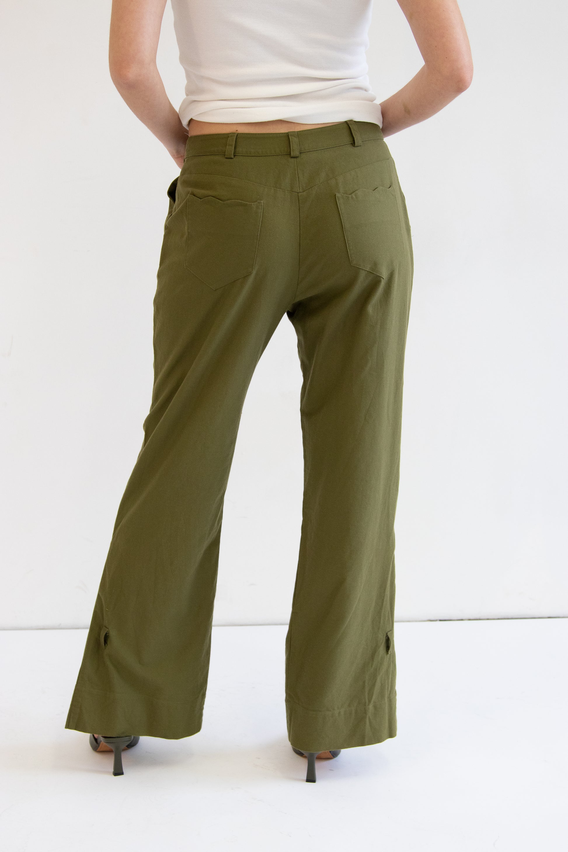 Close up back view of cotton khaki pants with wave detail back pockets