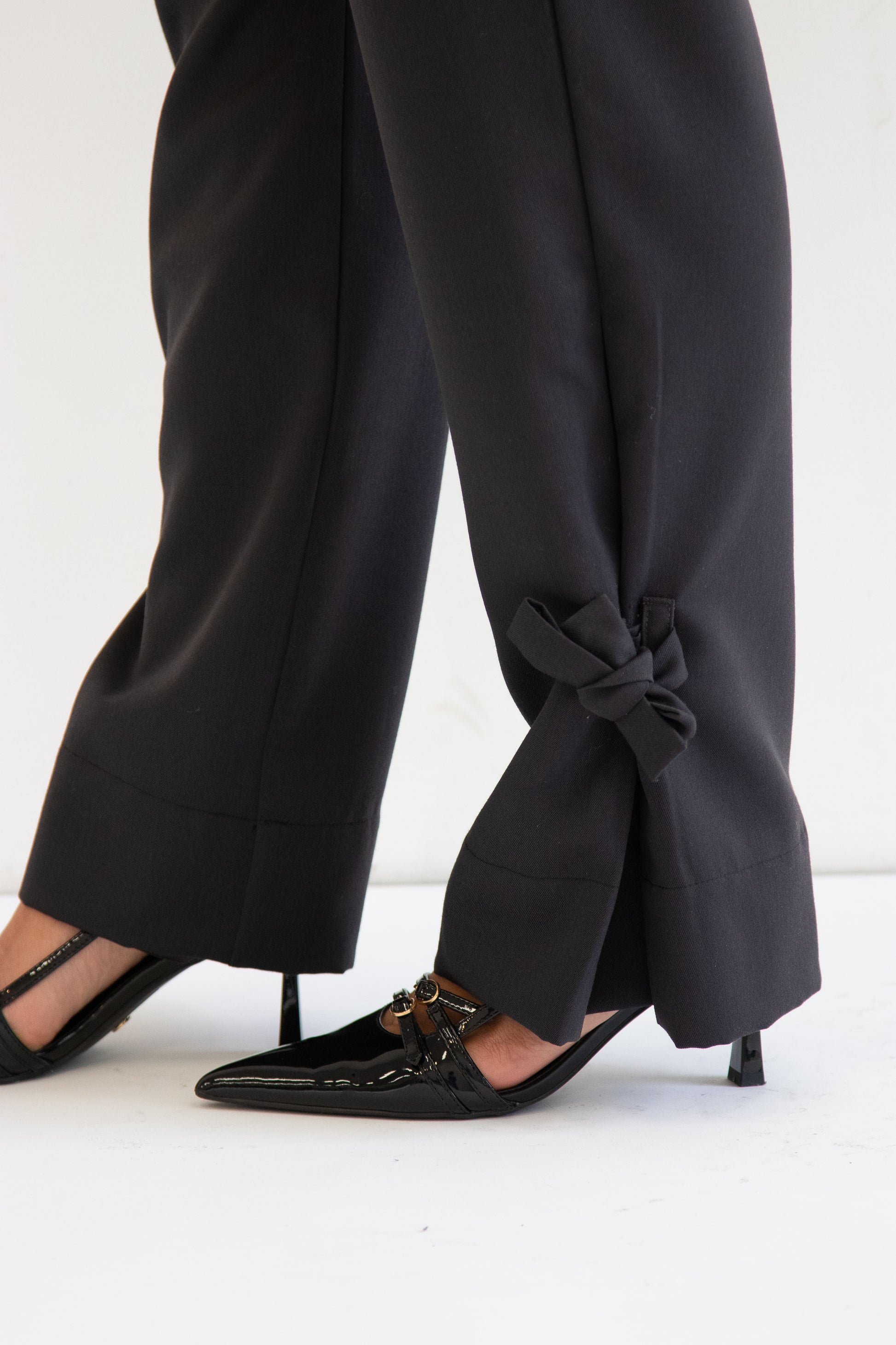 Close up view of ties at hem tied into a bow