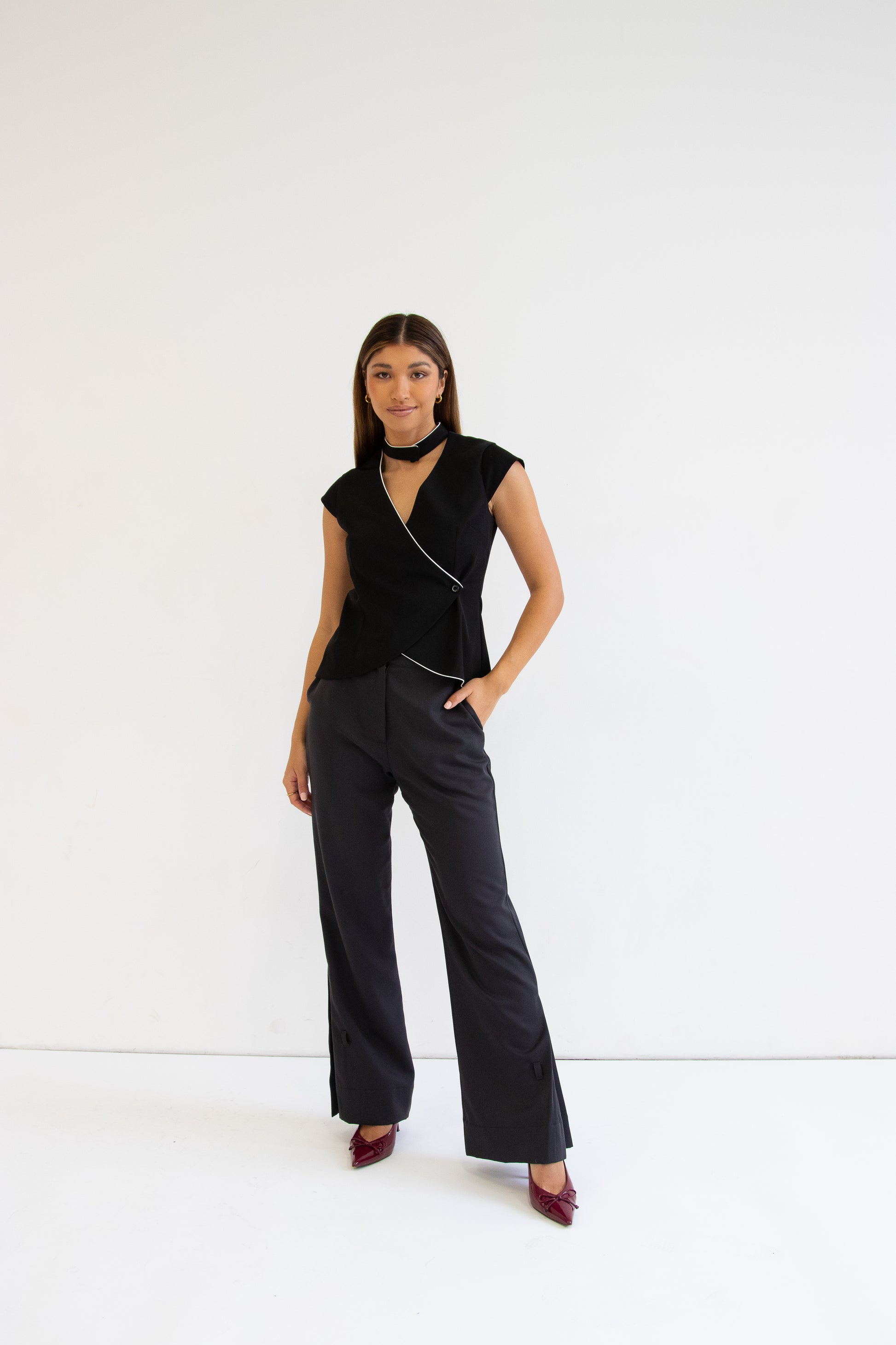 Front view of model wearing valerie vest with heidi pant and heels
