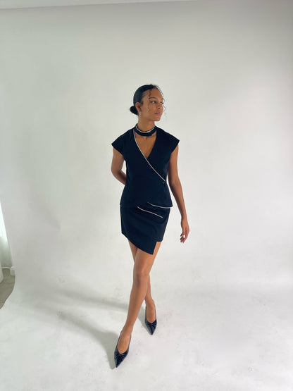 matching black vest and skirt set with capped sleeves and ivory piping